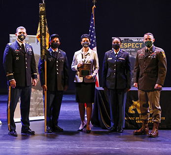 President Breaux (center) accepts award