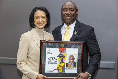 Dr. Aminta H. Breaux presents Benjamin Crump, Esq. with an award