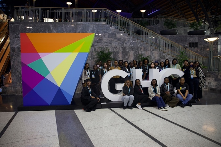 Grace Hopper group photo at GHC sign